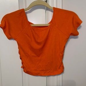 vibrant orange baby tee with cutouts